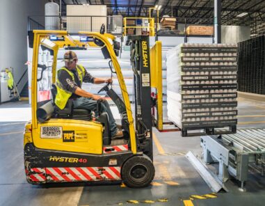 worker using a forklift in a warehouse